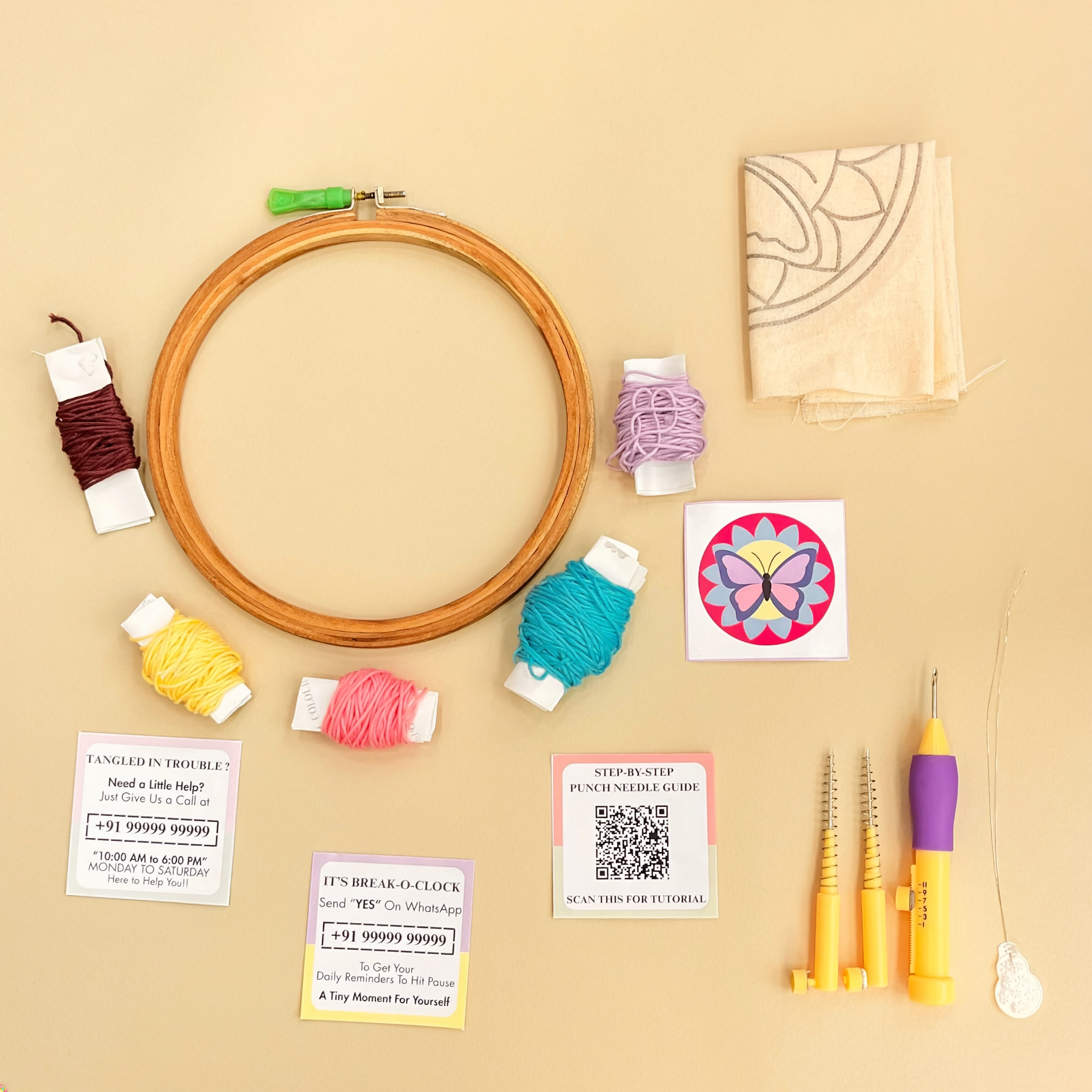 Full flatlay of Soul Wave workshop kit contents including yarn, hoop, fabric, and punch needle tools